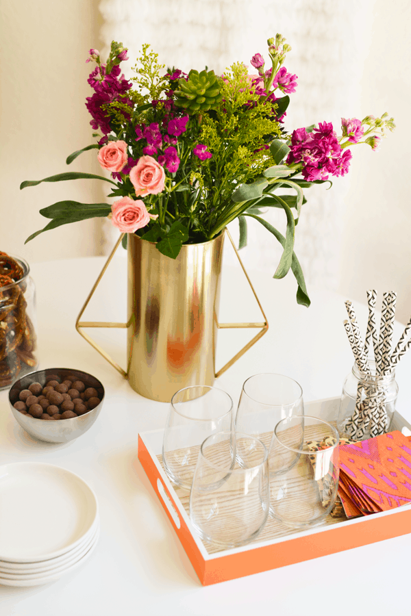 Fresh spring flowers are a great way to add a pop of color to your home. You'll be party ready instantly! And how great is that gold vase?! 