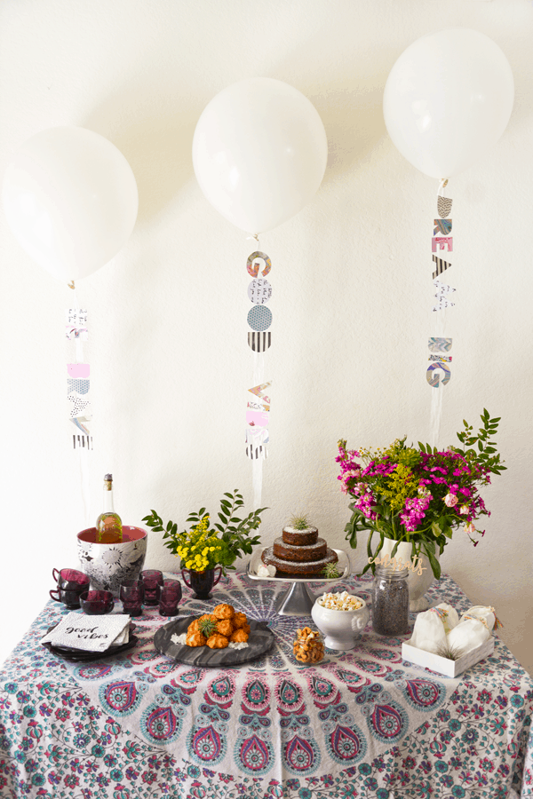 This boho baby shower with an easy balloon backdrop is pretty and cool. 