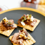 This is the perfect easy appetizer for your next party. The only cooking you need to do is on the grill so they come together super fast and are delicious! It's the perfect appetizer for a barbecue. Plus the blue cheese, balsamic and thyme pair perfectly with the cracker and steak.