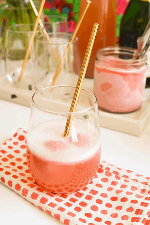 Yum! Here's a perfect summer cocktail idea! Top strawberry sherbet with strawberry lemonade plus a splash (or more) of champagne. Champagne cocktails are easy to make and this one is extra refreshing! 