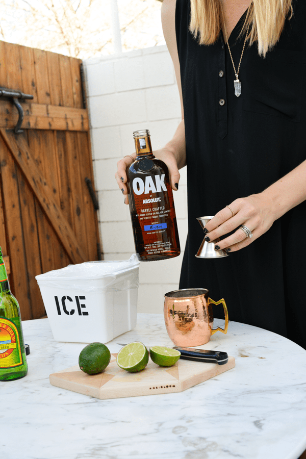 Pouring Oak by Abosolut for a Moscow Mule cocktail.