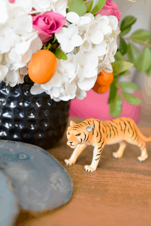 A toy tiger on a table. 