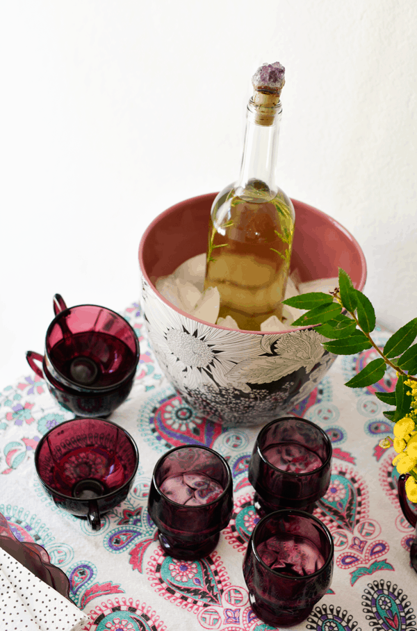 Infused wine is super easy to make and doesn't even require a recipe. Pick your favorite herbs and citrus and create your own herbal wine flavors. | Cupcakes and Cutlery