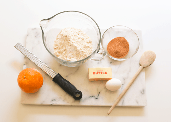 Ingredients to make Orange Snickerdoodles on a table. 