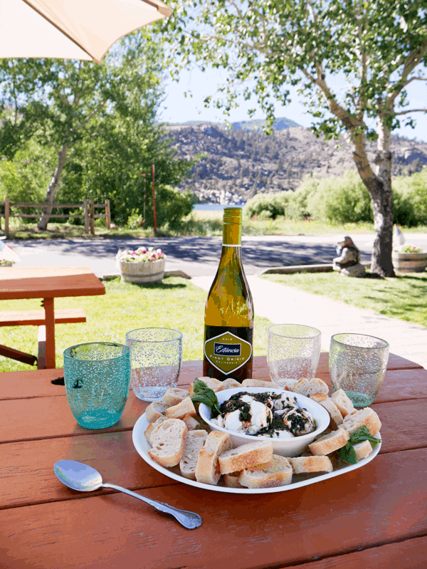 This burrata appetizer pairs really well with white wine. It was the perfect simple recipe to make while on our lake vacation. | Cupcakes and Cutlery