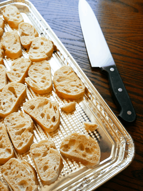 I love to rub raw garlic on toasted crostini to give it a little bit of extra flavor without the bite. These are perfect for serving with a simple burrata appetizer recipe topped with basil oil. | Cupcakes and Cutlery