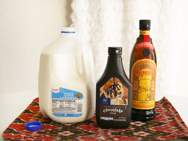 Ingredients to make a large batch of white russians.