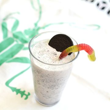 Grasshopper milkshake topped with an oreo and gummy worm.