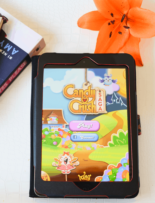 An ipad open with the game "candy crush" on the screen. 