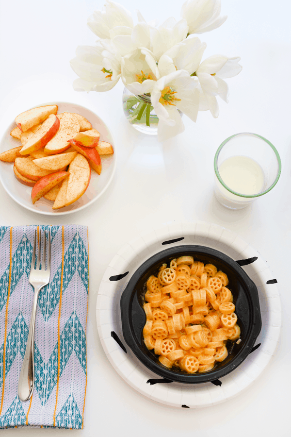 kid fresh frozen meal on a table with a side of apples for getting dinner on the table fast on a busy weeknight