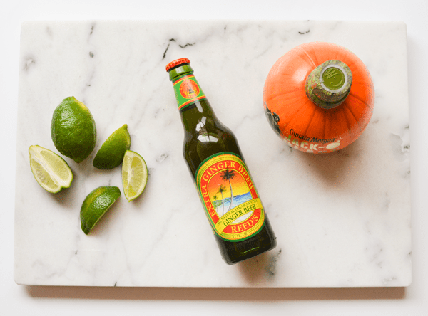 Ingredients for a Rum Pumpkin Mule on a table. 