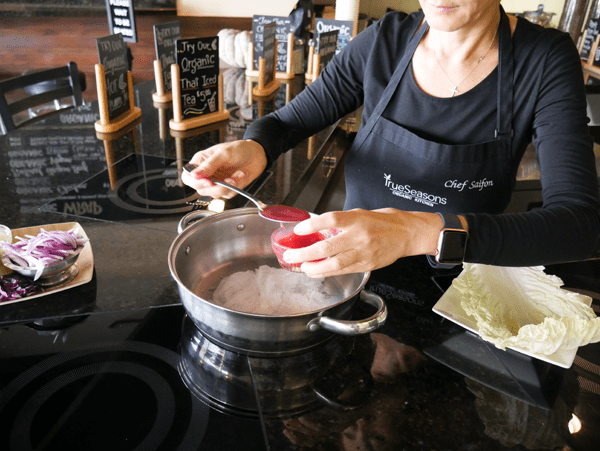 Chef Saifon making glass noodle in a walk and adding some fresh fruit juices. 