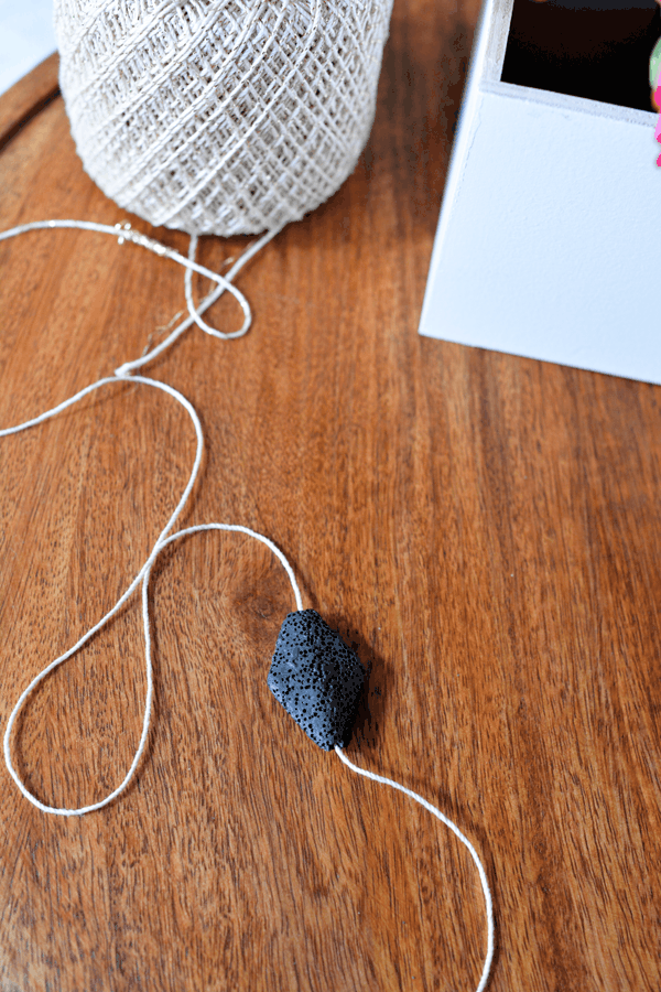 Lava stone bead on a string for an essential oil diffuser for the shower.