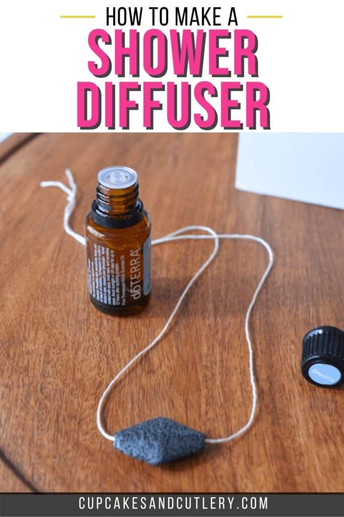 Image contains a DIY shower diffuser and essential oil bottle with the caption how to make a shower diffuser.