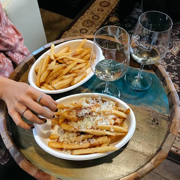 Fries and wine on a table at Lorimar winery in Temecula. 