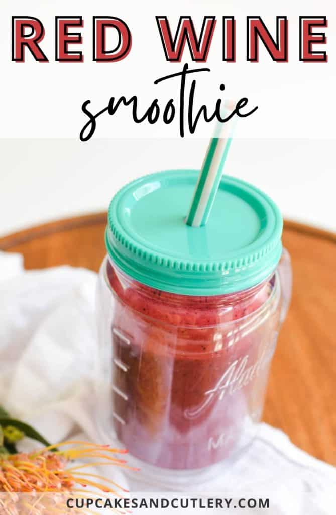Insulated cup on a table with text that says "red wine smoothie."