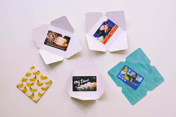 gift cards laying on top of homemade paper envelopes 