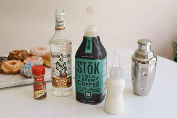 Ingredients to make a White Russian with Coffee on the table. 
