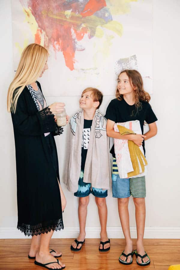 A woman enjoying overnight oats with her children.