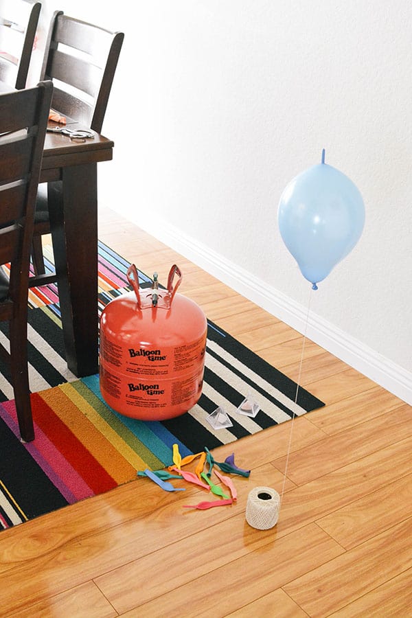 Filling balloons with a balloon time helium tank.