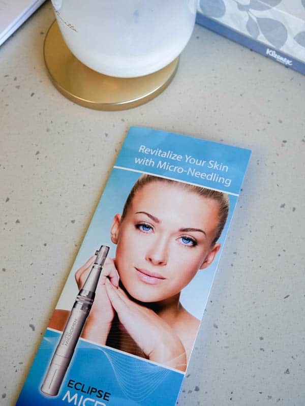 A pamphlet about microneedling on a counter. 