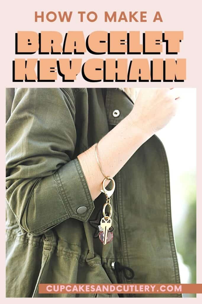 Woman wearing a bangle bracelet with a keychain attached.