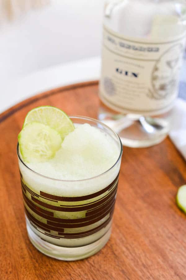 gin cocktail on a wooden tray