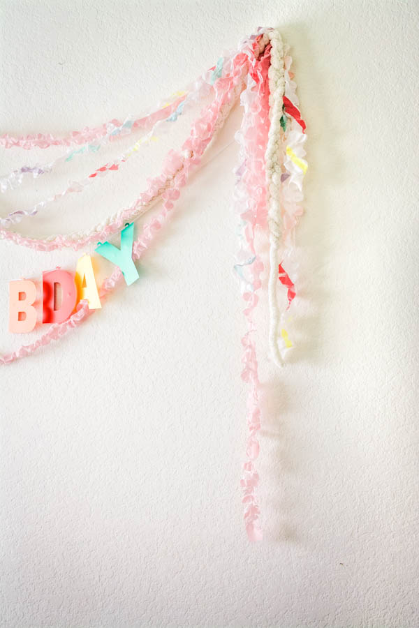 Plastic streamers on a wall for party decorations.