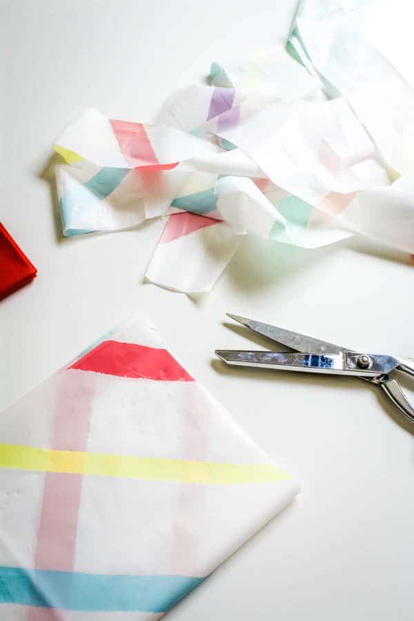 Cut plastic tablecloths to make into party streamers.