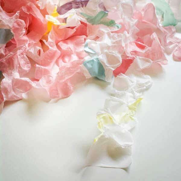 DIY Ruffled Plastic Tablecloth Streamers For Parties