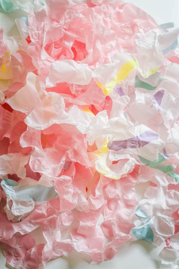 Ruffled streamers from plastic tablecloths to be used as party garlands.