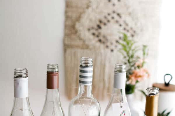 The tops of 5 bottles of the best affordable rose wine for a wine tasting.