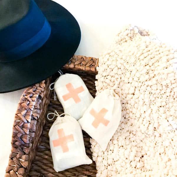 Bags with first aid cross on them for talking about self care for moms