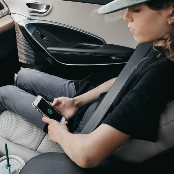 Tween boy listening to rap playlist