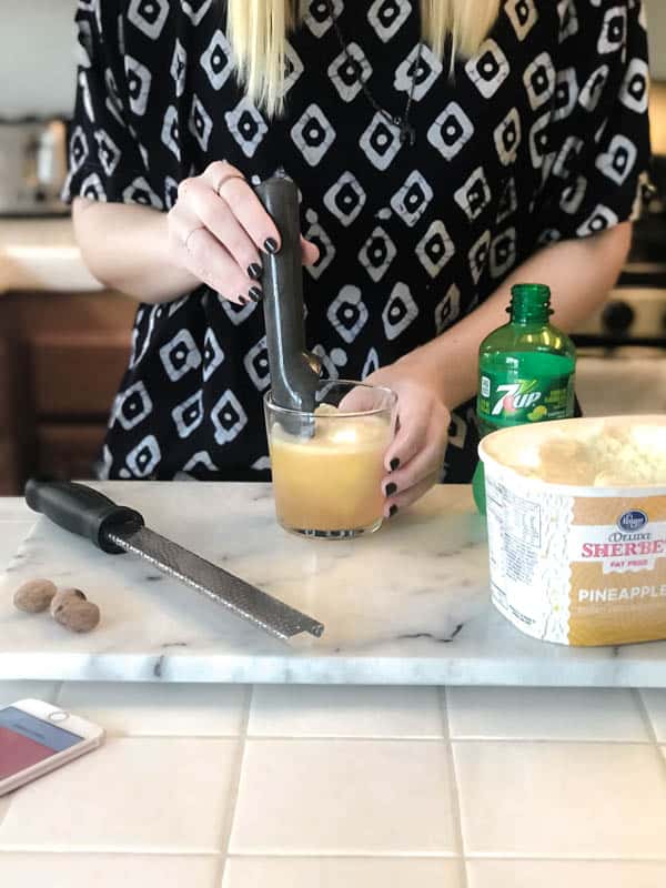 Making a Spiced Rum Pineapple Float cocktail