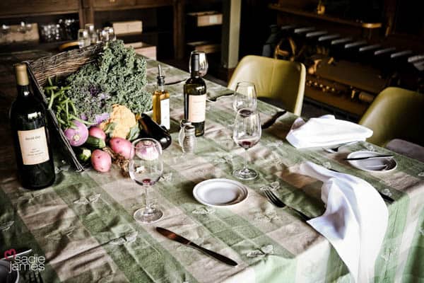 Fall inspired dining table for an outdoor movie night party inside a barn.