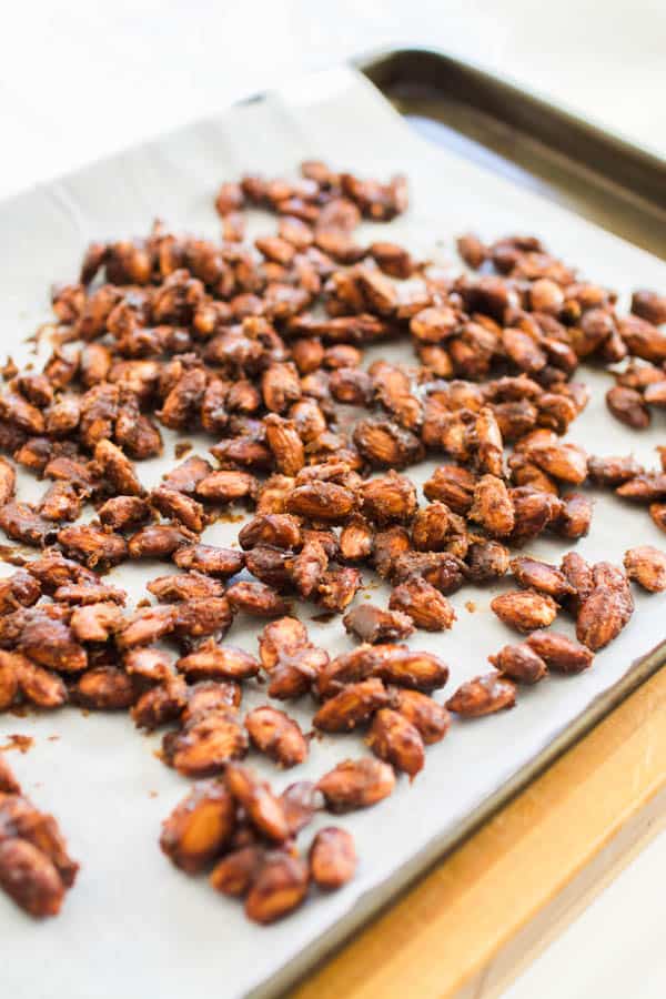 Cinnamon candied almonds on a sheet pan.