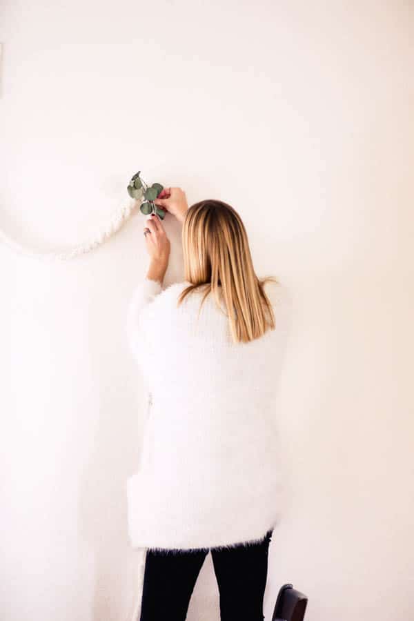 Make this DIY knotted yarn garland with eucalyptus