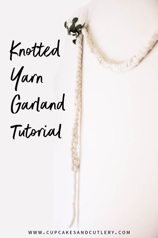 Yarn Garland on a wall with text overlay.