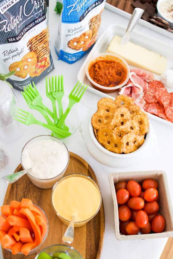 Store-bought snacks on a table for a football party at home. 