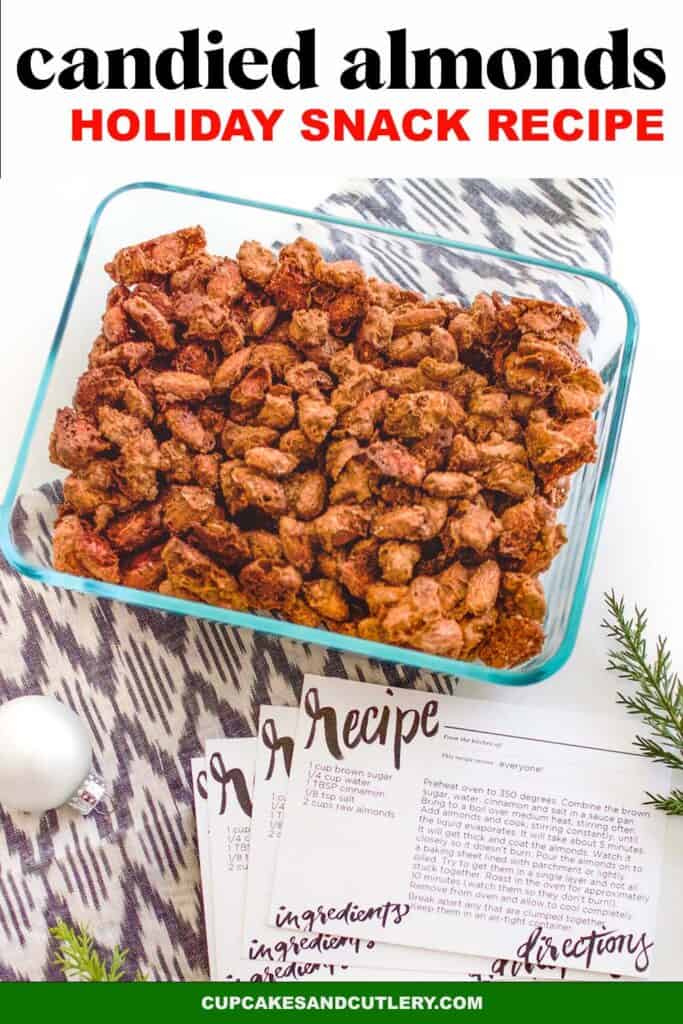 Candied almonds in a glass dish next to recipe cards.