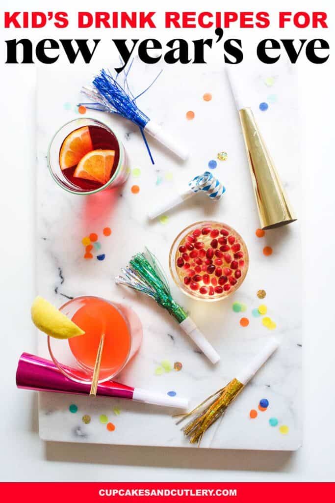 Top down view of a table top filled with confetti, noisemakers and non alcoholic drinks with text that reads Kid's Drink Recipes for New Year's Eve.