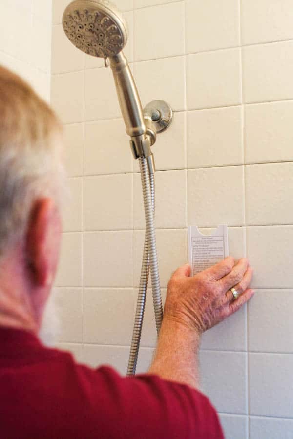 Man installing a shower diffuser.