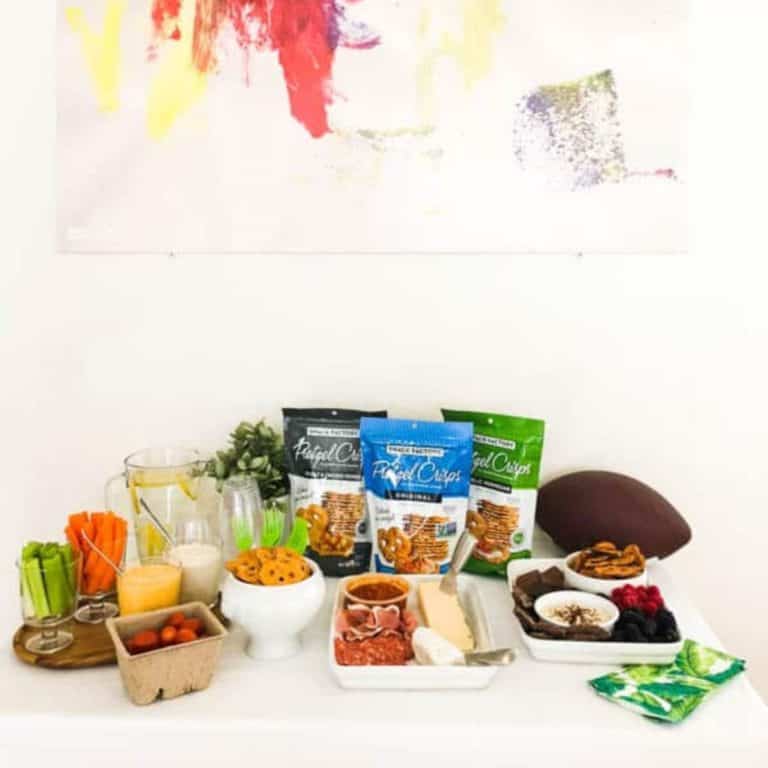 Store-bought snacks for a football party on a table.
