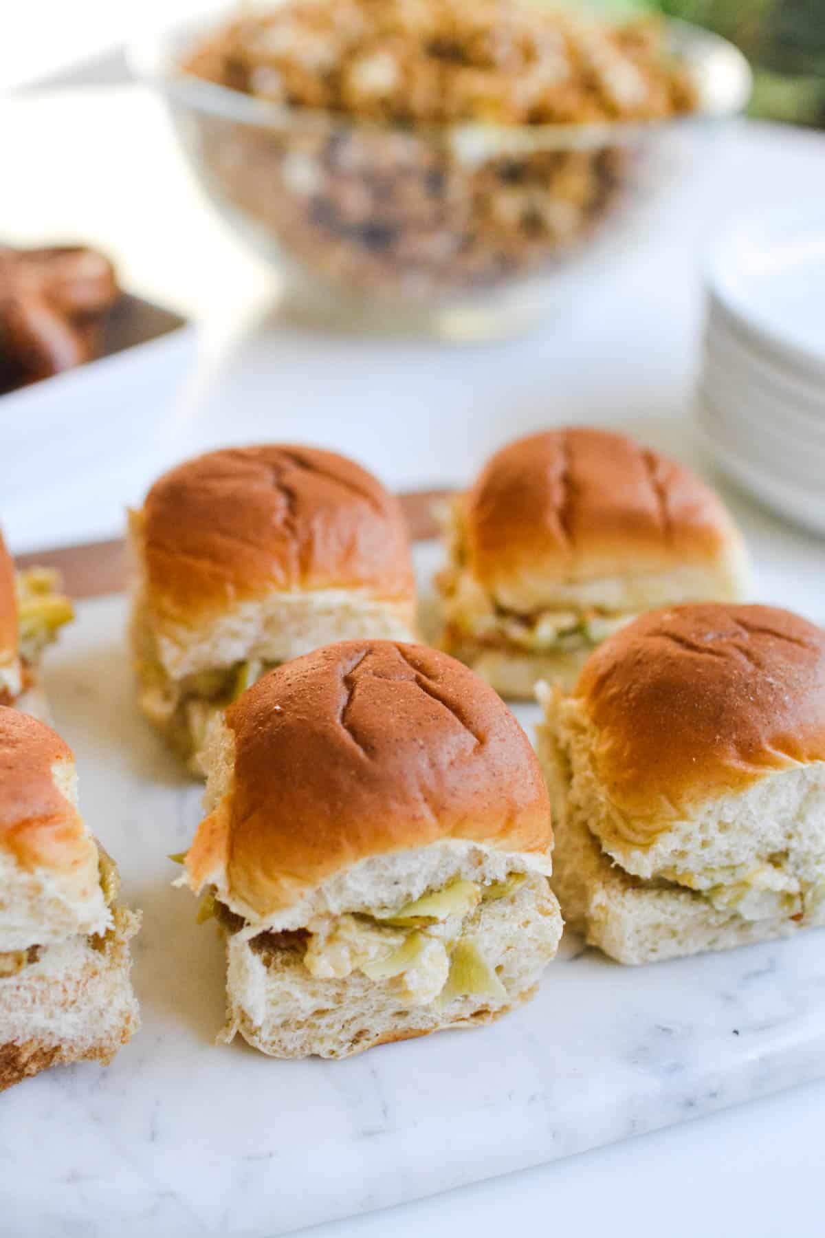 A tray of slides on a table next to other party food.