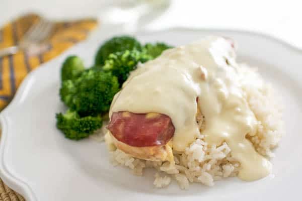 Baked chicken on top of rice topped with dried beef and creamy sauce. 