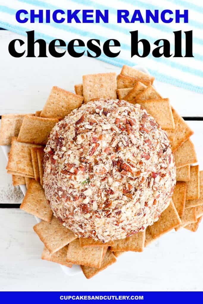 A pecan crusted chicken ranch cheese ball on a plate with crackers.