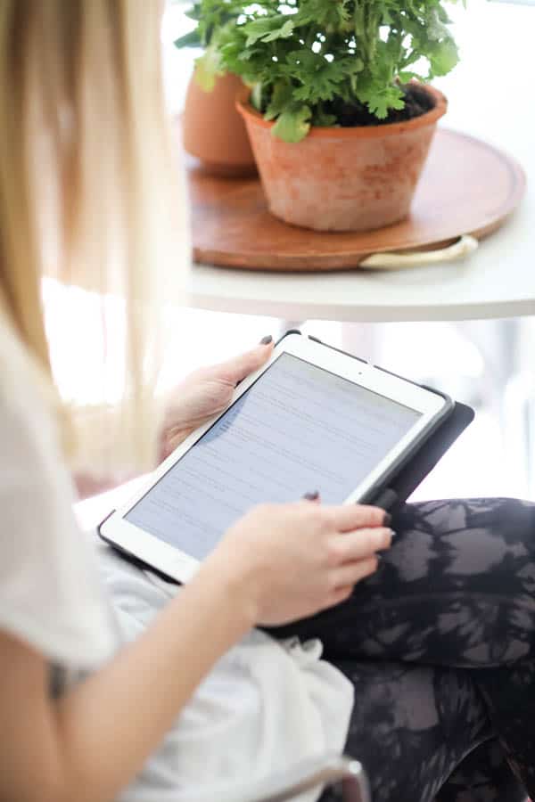 Woman reading an Ipad. 