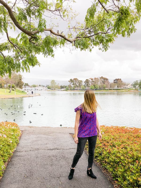 bright sleeveless blouse with ruffles from cabi