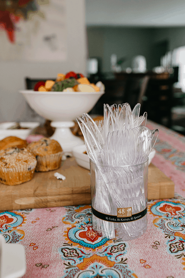 Chinet cutlery on a table next to brunch food.